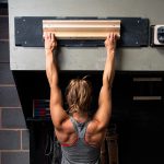 A woman using the fingerboard