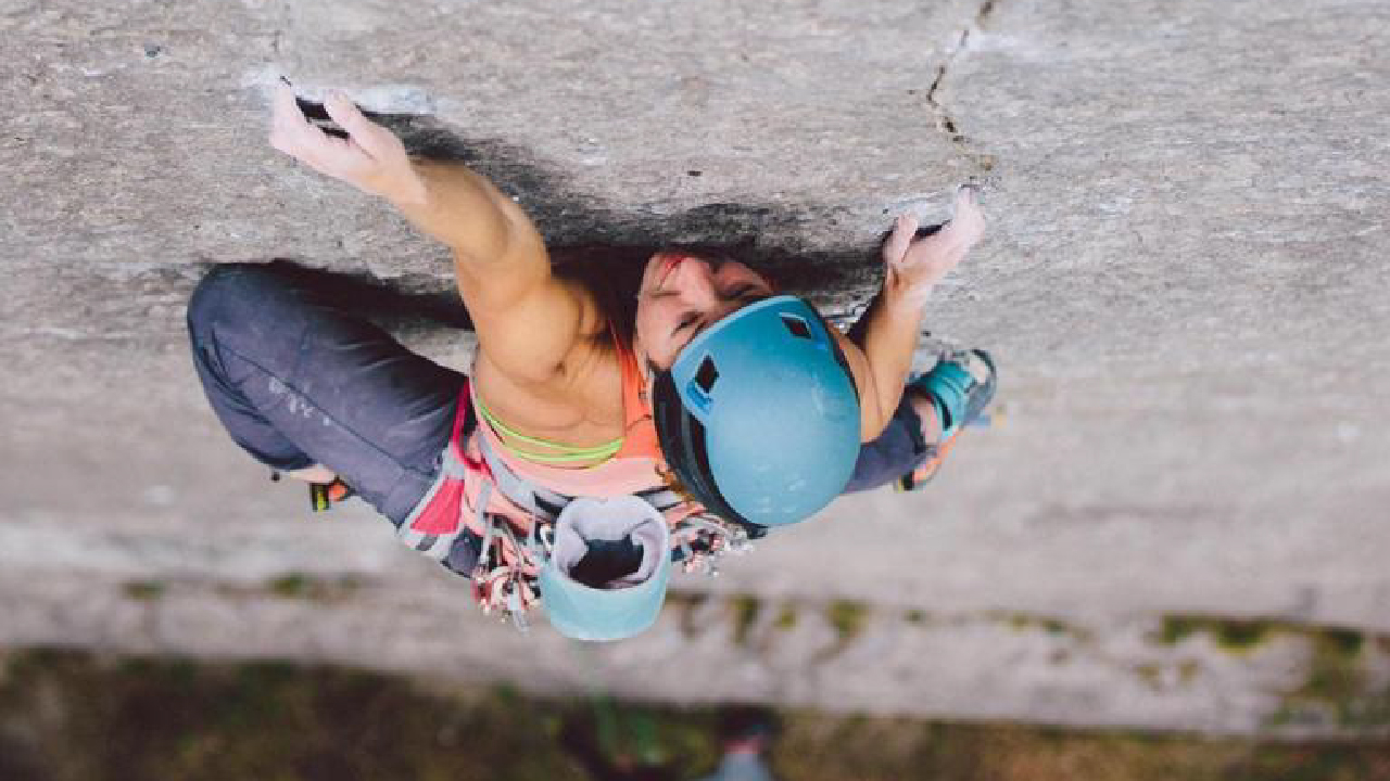 Female Climber, Maddy Cope climbing