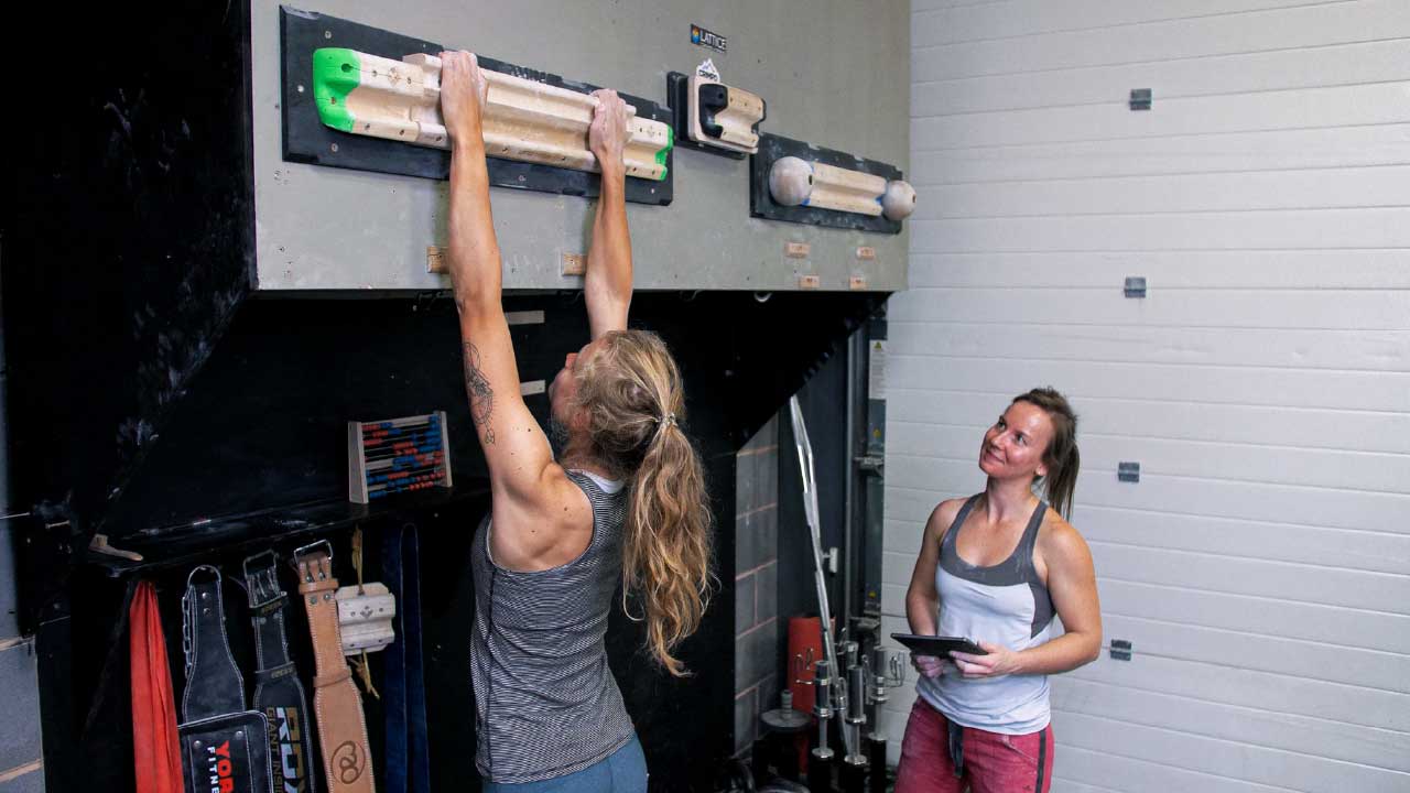 Athena fingerboarding on a large edge to start with, under the watchful eye of coach Ella. Reccomended for beginners training for climbing. 