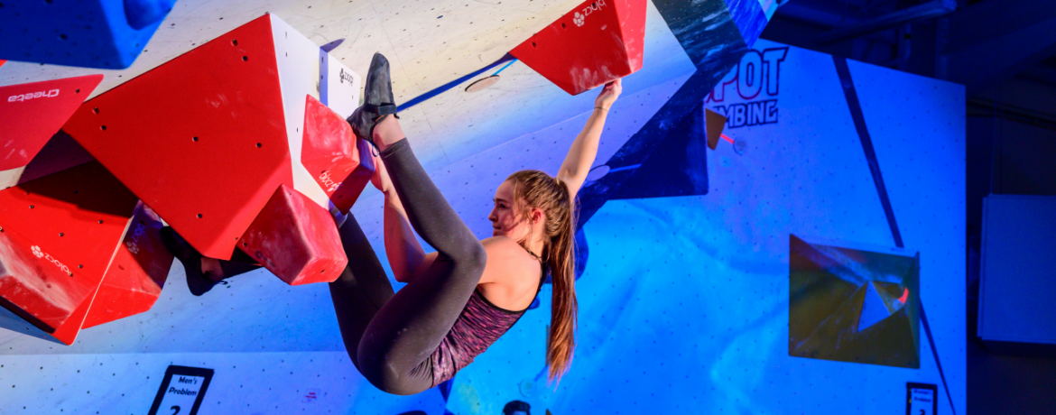 Hannah Smith in a competition overhang boulder