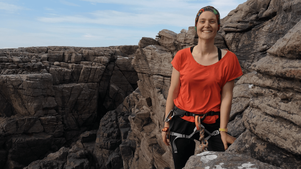 Dr Lisa Bastian - rock climbing