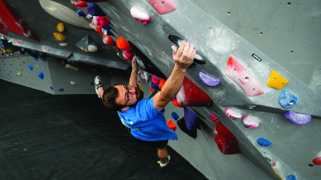 Lattice athlete Will Bosi, bouldering on an indoor wall to maintain strength and power!