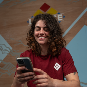 frran looks at her phone using the in-app coach chat feature