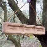 MXEdge Switch portable hangboard hanging from a tree
