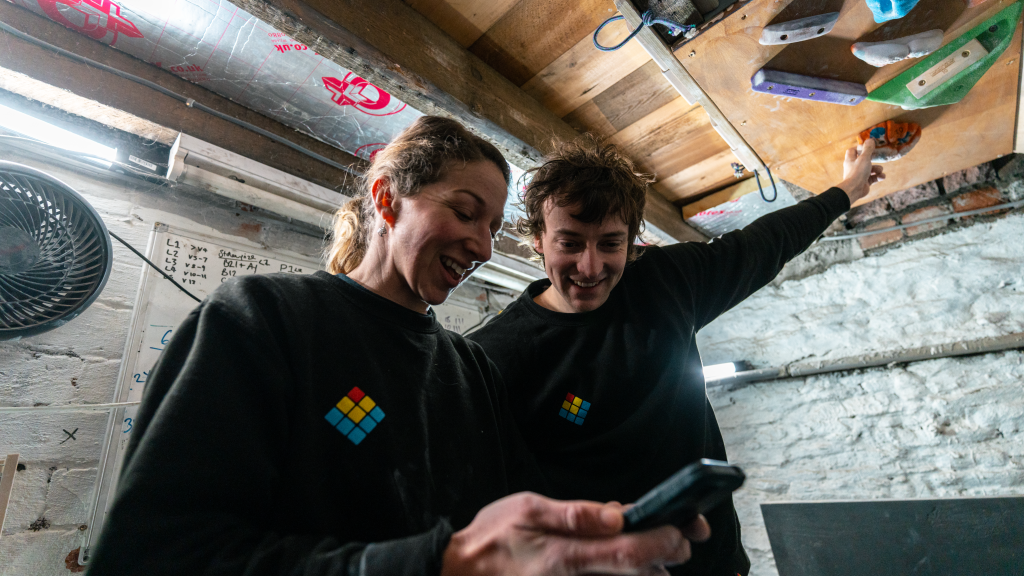 Lattice coaches, Maddy Cope and Oli Grounsell tring a LatticePlan.