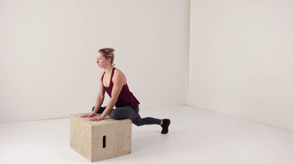 Lattice coach demonstrating elevated pigeon pose stretch. Good for climbers and runners. 